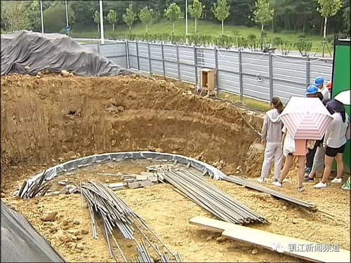 致敬高温下的坚守者 丁卯桥路给水管道工程预计下月底完工